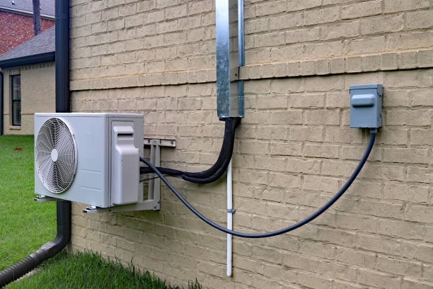 Professional HVAC technician servicing mini split